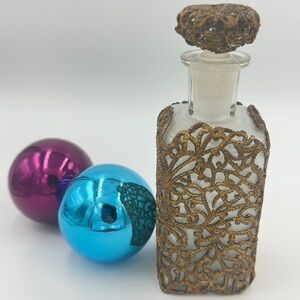 Ornate Glass Bottle with Bronze Detailing Filigree